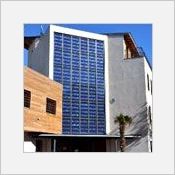 Tanagra, le mur-rideau et verrire  intgration de panneaux photovoltaques