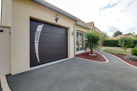 Porte de garage sectionnelle plafond : allier modernité et style intemporel