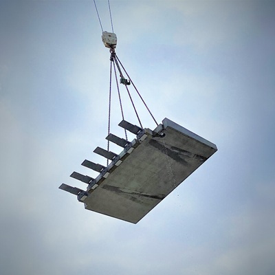 Construction hybride : comment maîtriser les liaisons entre bois, béton et acier ?